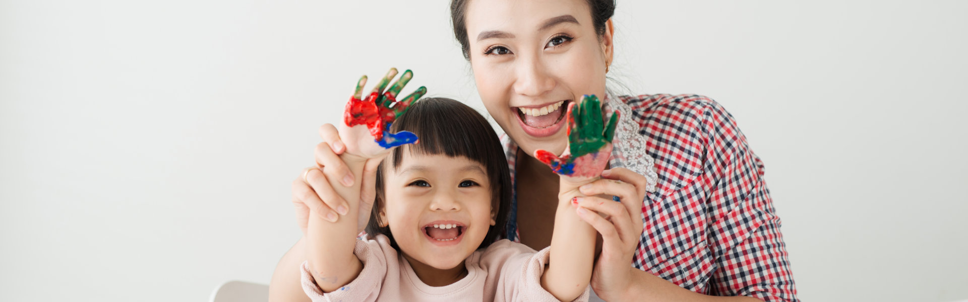 Mom help her daughter drawing