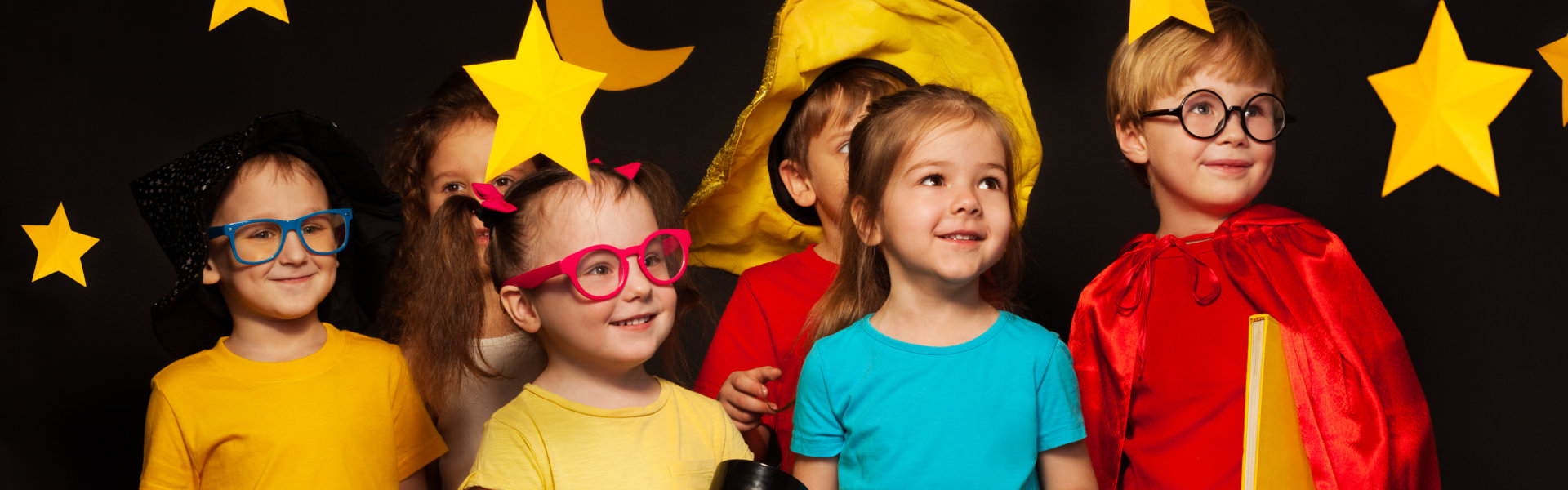 Six friends in sky watcher costumes watching stars